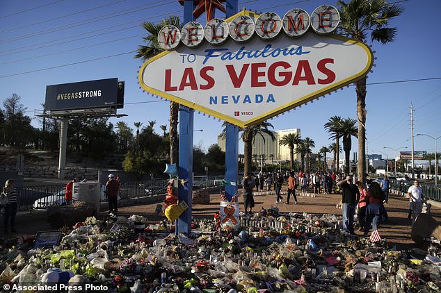 Flowers%2C+candles+and+other+items+surround+the+famous+Las+Vegas+sign+at+a+makeshift+memorial+for+victims+of+a+mass+shooting+Monday%2C+Oct.+9%2C+2017%2C+in+Las+Vegas.+Stephen+Paddock+opened+fire+on+an+outdoor+country+music+concert+killing+dozens+and+injuring+hundreds.+%28AP+Photo%2FJohn+Locher%29